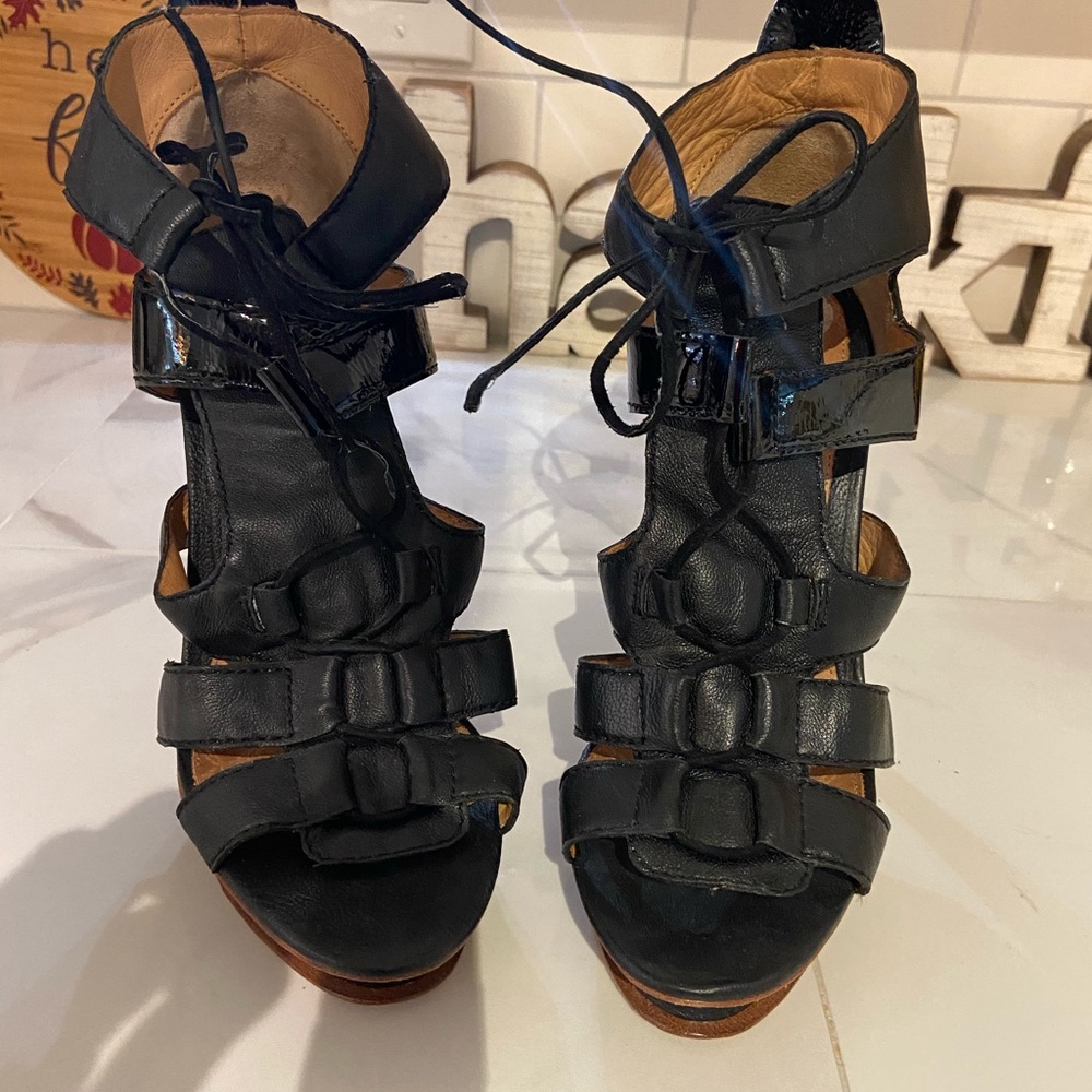 Woman’s black lace up heels